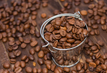 Background natural black coffee.Grain black coffee in bulk. Roasted beans Black coffee. Grain black coffee in bulk.