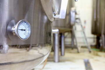 Pressure gauge on brew tank in small scale brewery