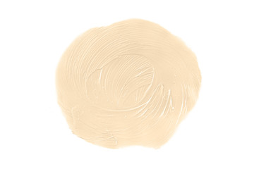 Round face make-up creme foundation sample on a white background