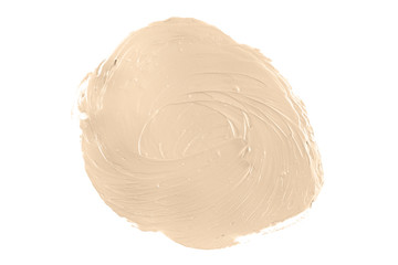 Round face make-up creme foundation sample on a white background