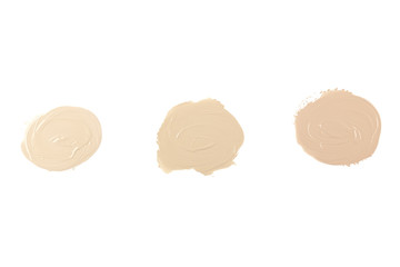 Set of three face make-up liquid foundation samples on a white background