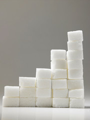 Ascending stacks of sugar cubes - high blood sugar risk concept