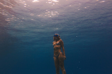 Woman free-diving in sea