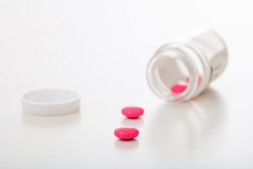 Capsules out of a bottle