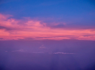 ariel view of clouds and sky in sunset above city