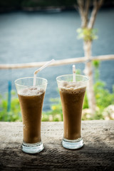 Glasses Of Cold Coffee On Wood outside. Tropical island, Indonesia, Asia.
