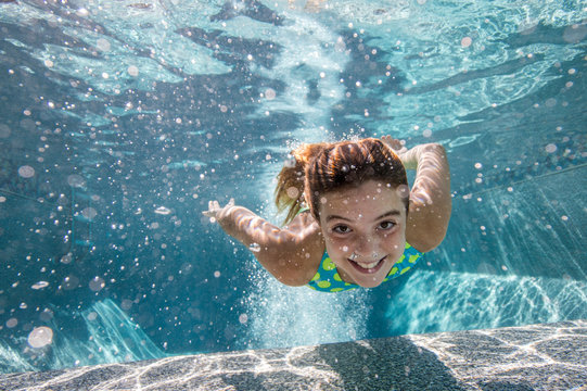 Girl swimming in pool