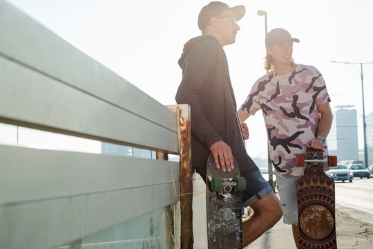 Skateboarders standing and talking, Budapest, Hungary