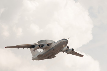 Beriev A-50 (Mainsta) Russian airborne warning and control system (AWACS) aircraft  flies on cloudy sky background