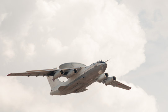 Beriev A-50 (Mainsta) Russian Airborne Warning And Control System (AWACS) Aircraft  Flies On Cloudy Sky Background