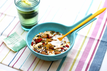 Healthy breakfast bowl with yogurt, cereals, super foods and nuts