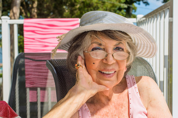 Senior woman relaxing on deckchair