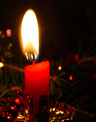 Burning red candle flame