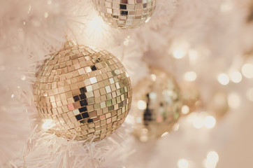 White Christmas decoration with balls on fir branches with bokeh 