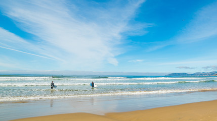 Surfers in Pismo Beach