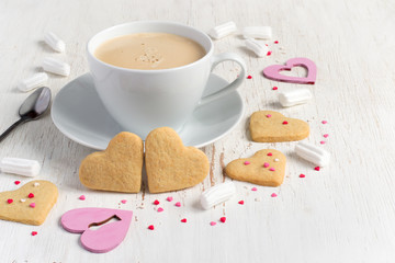 Valentines day heart shaped cookies and cup of coffee