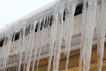 Icicles on the roof. cold winter weather concept, soft focus, shallow depth of field. macro view