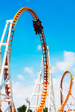 Low angle view of looped roller coaster at Coney Island amusement park, New York, USA