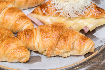 fresh croissants on wooden table
