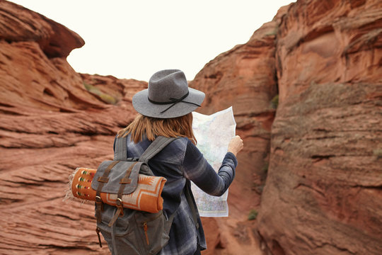 Woman looking at map, rear view, Page, Arizona, USA