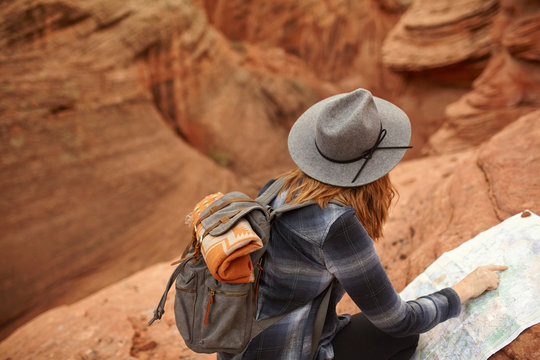 Woman looking at map, rear view, Page, Arizona, USA