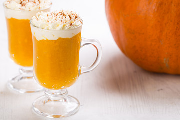 Pumpkin spiced latte or coffee. Autumn or winter hot drink. 