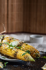 grilled corn on with lemon, herbs and spices