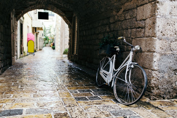 White vintage bicycle at old town in Budva, Montenegro
