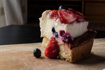Fruit Tart Slice with strawberry and berries.