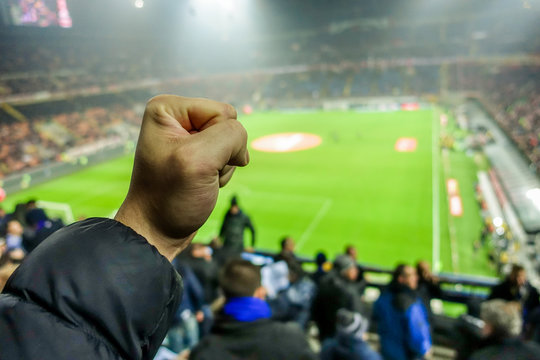 Soccer fan celebrate their team in football italian stadium 