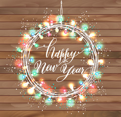 Happy new year design on wooden texture.