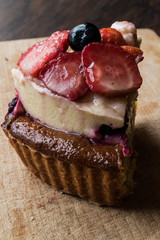 Fruit Tart Slice with strawberry and berries.