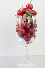 Strawberry berries in a glass of wine.