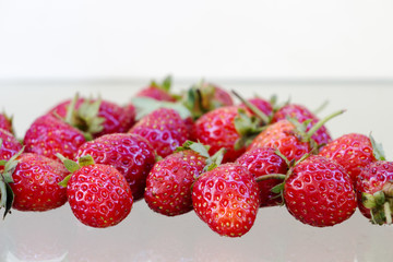 Strawberry berries on the ground.