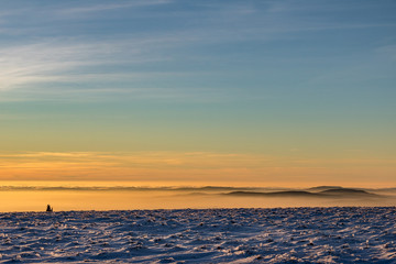Fototapeta na wymiar Minimalist winter mountain sunset landscape