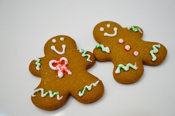 Two gingerbread men cookies decorated for Christmas