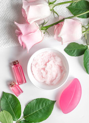organic cosmetic with rose oil on white background top view
