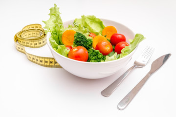 concept diet fresh vegetables on plate at white background