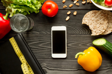 concept diet and smartphone with vegetables mock up