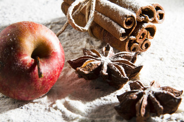Rustic Christmas decoration with cinnamon apple anise tangerine candle...