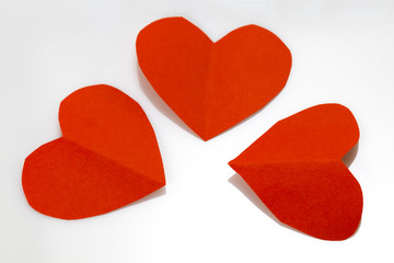 three red hearts isolated on white