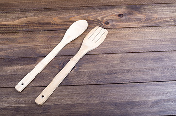Wooden kitchen attributes laying on the floor. Horizontal studio shot