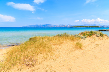 View of beautiful sandy Santa Maria beach with azure sea water on coast of Paros island, Greece