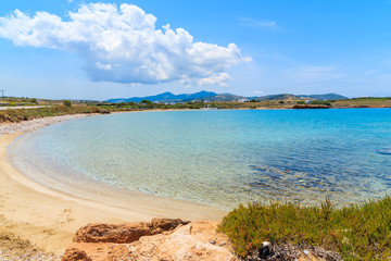 View of beautiful sandy beach with azure sea water on coast of Paros island, Greece