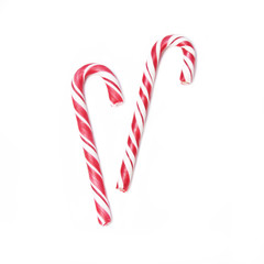 Pair of Christmas candy can on white background