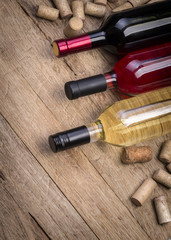 Fototapeta na wymiar Glass bottle of wine with corks