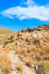 Fototapeta na wymiar Rocks on coastal path near Monastiri bay on Paros island, Greece