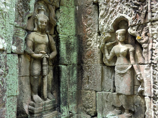 Ancient stone carving figures cut in Siem Reap Cambodia temple