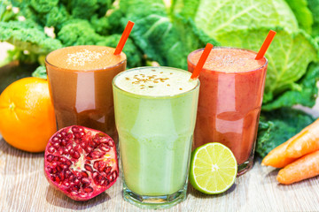 Organic raw fresh orange juice fruit vegetable green purple straw garnish