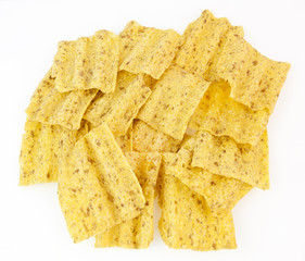 Stack of healthy baked corn chips. Isolated.